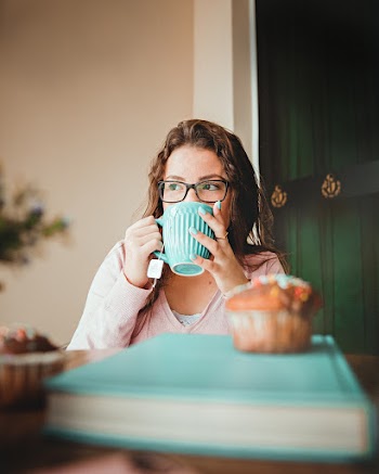 Woman Drinking On A Green Ceramic Mug