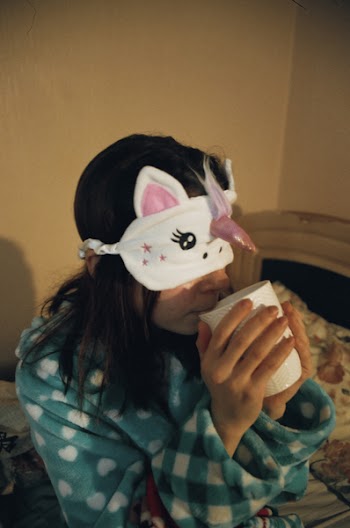 Woman Drinking on Cup While Blindfolded by Eye Mask