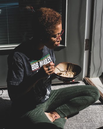 Woman Eating Bowl of Cereal