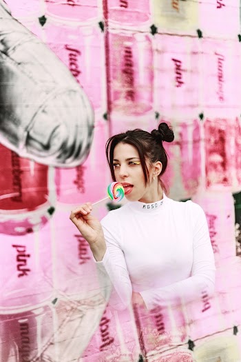 Woman Eating Lollipop