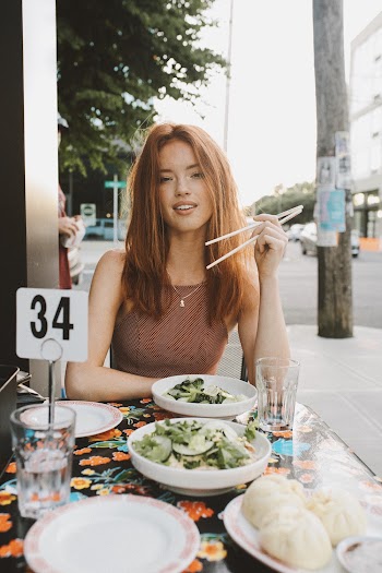 Woman Eating Outside