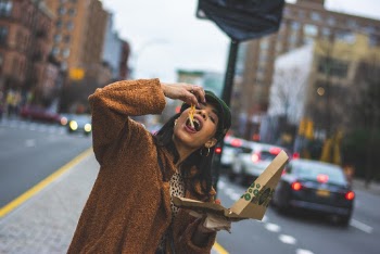Woman Eating Pizza