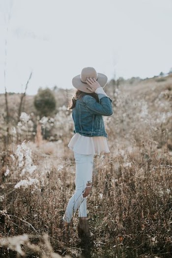 woman facing hill during daytime