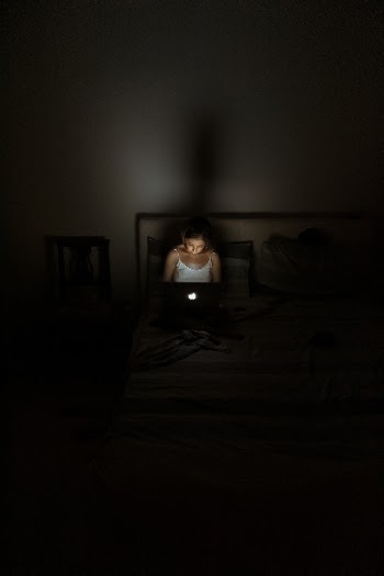 Woman Facing Macbook