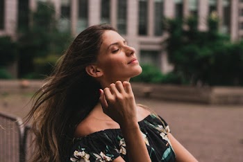 Woman Facing Right While Closing Her Eyes
