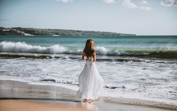 Woman Facing The Ocean
