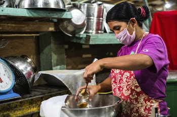 Woman filling ginger tea powder, | Free Photo - rawpixel