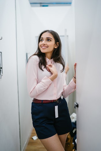 Woman Fitting Clothes