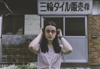 Woman Fixing Her Hair