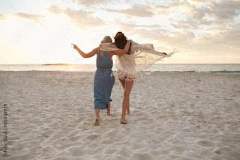 Woman friends enjoying a day on the beach