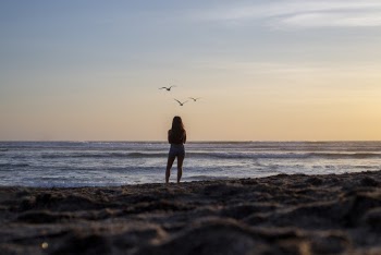 Woman Gazing At The Ocean View