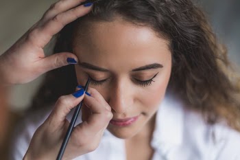 Woman Gets Eyeliner Applied