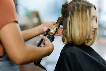 Woman getting her hair curled at a beauty… | Free stock photo | High Resolution image