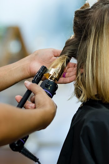 Woman getting her hair curled at a beauty… | Free stock photo | High Resolution image