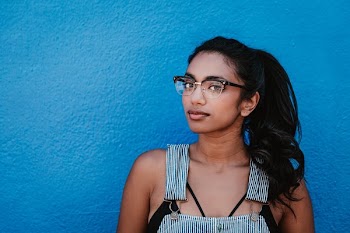 Woman Glasses Ponytail Blue Wall