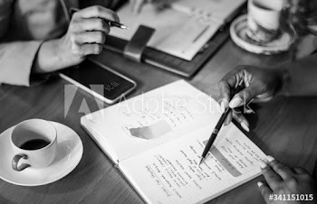 Woman going through notes in a notebook