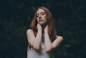 Woman Grabbing Her Neck
