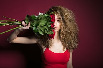 Woman Grasping Flowers
