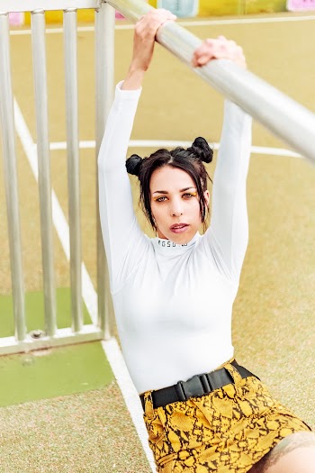 Woman Hanging On Metal Pipe