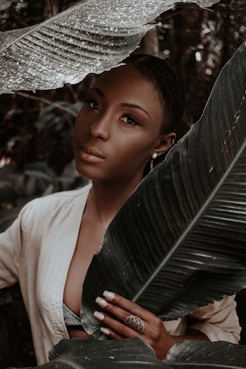 Woman Hiding Behind Banana Leaves