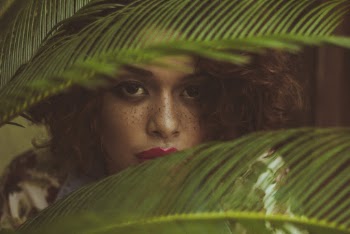 Woman Hiding Behind Leaves