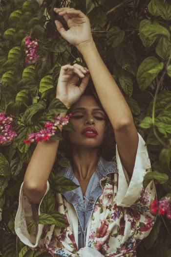 Woman Hiding Behind Leaves
