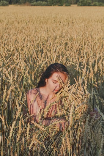 Woman Hiding on Field