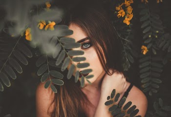 Woman Hiding Under Green Leafed Tree