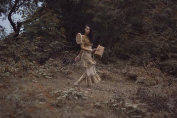 Woman Holding A Basket