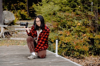 Woman Holding a Camera