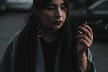 Woman Holding a Cigaratte
