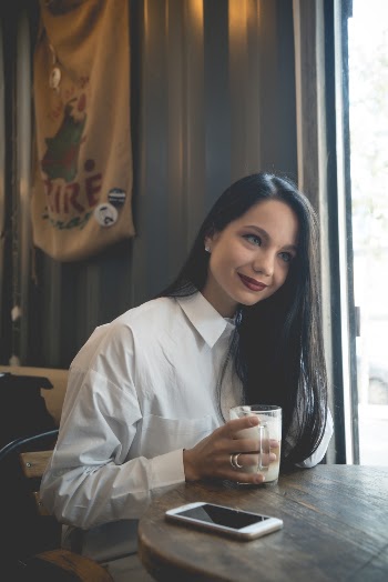 Woman Holding A Cup
