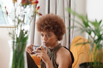 Woman Holding A Cup