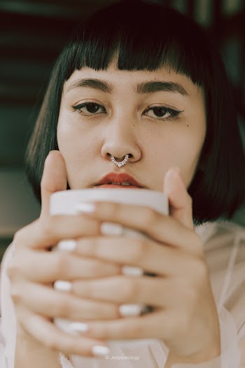 Woman Holding a Cup