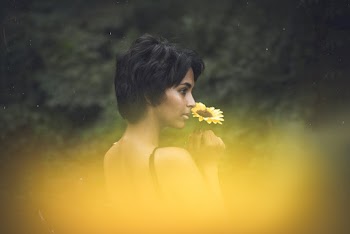 Woman Holding A Flower 