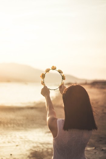 Woman Holding a Flower Crown