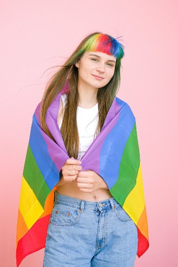 Woman Holding a Gay Pride Flag
