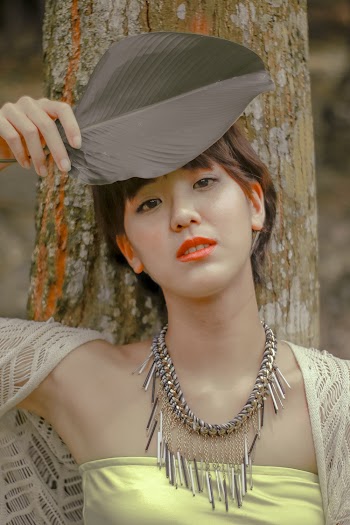 Woman Holding A Leaf