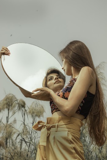Woman Holding a Mirror