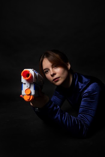 Woman Holding a Nerf Gun