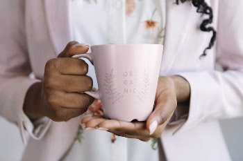 Woman holding a pink mug | Free PSD Mockup - rawpixel