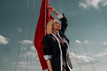 Woman Holding a Red Flag