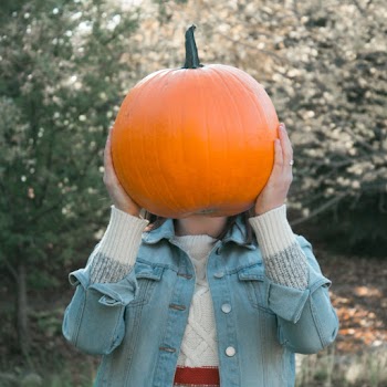 Woman Holding a Squash