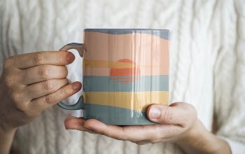 Woman holding a sunset mug | Free Photo - rawpixel