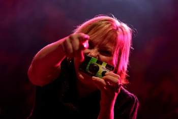 Woman Holding An Instant Camera