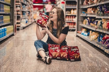 Woman Holding Bag Of Chips