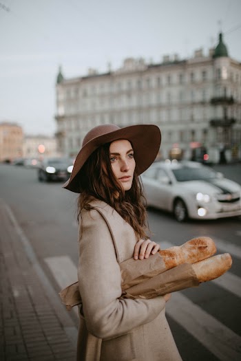 Woman Holding Baguettes