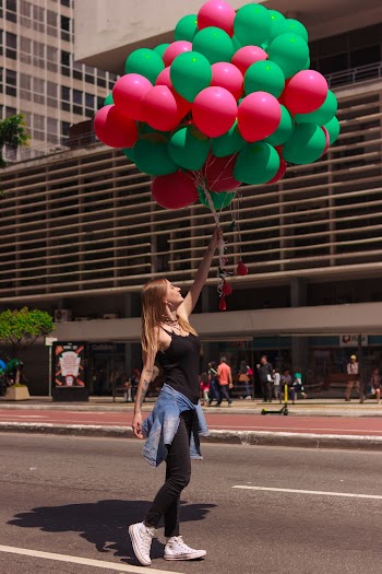 Woman Holding Balloons