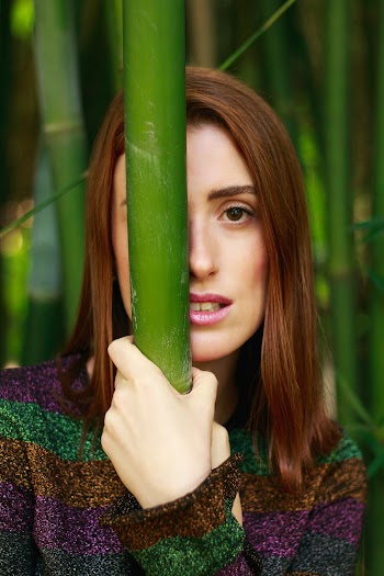 Woman Holding Bamboo