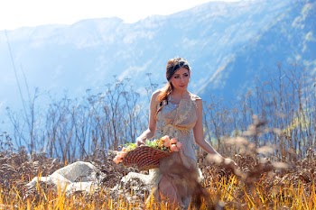 Woman Holding Basket of Flowers